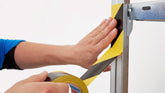 tesa® 60760 Golvmarkeringstejp - tesa-60760-soft-pvc-floor-marking-hazard-tape-black-yellow-step2of4-ap.jpg